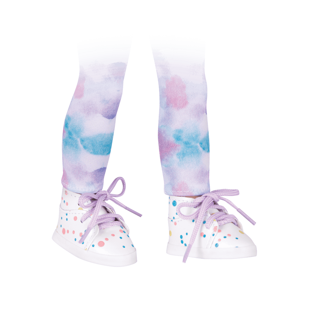 Watercolor patterned leggings and paint-spattered high-top sneakers