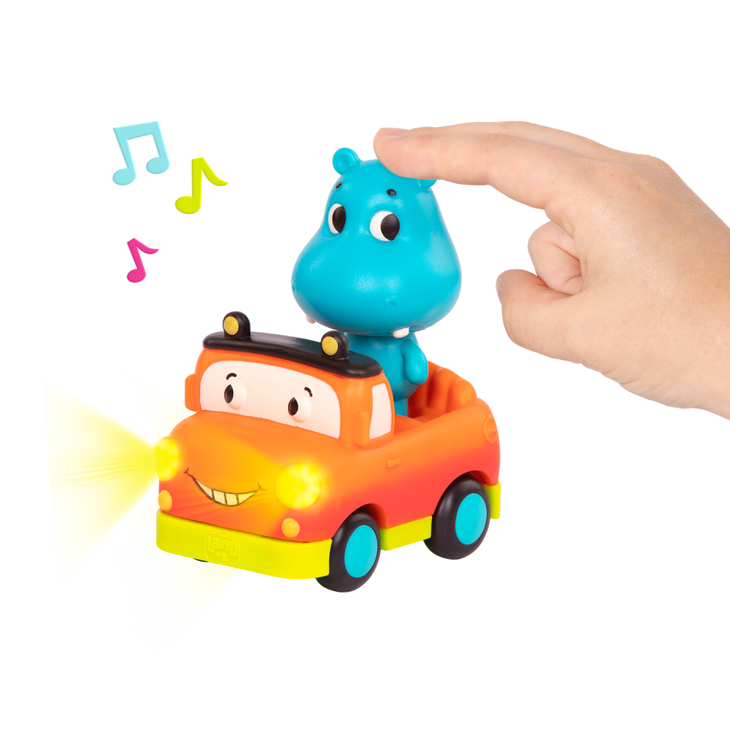 Light-up toy hippo in pickup truck
