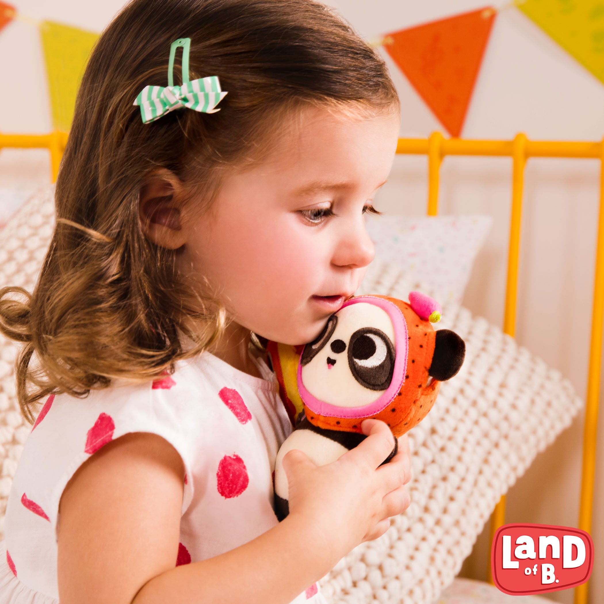 Plush panda with a strawberry hood.