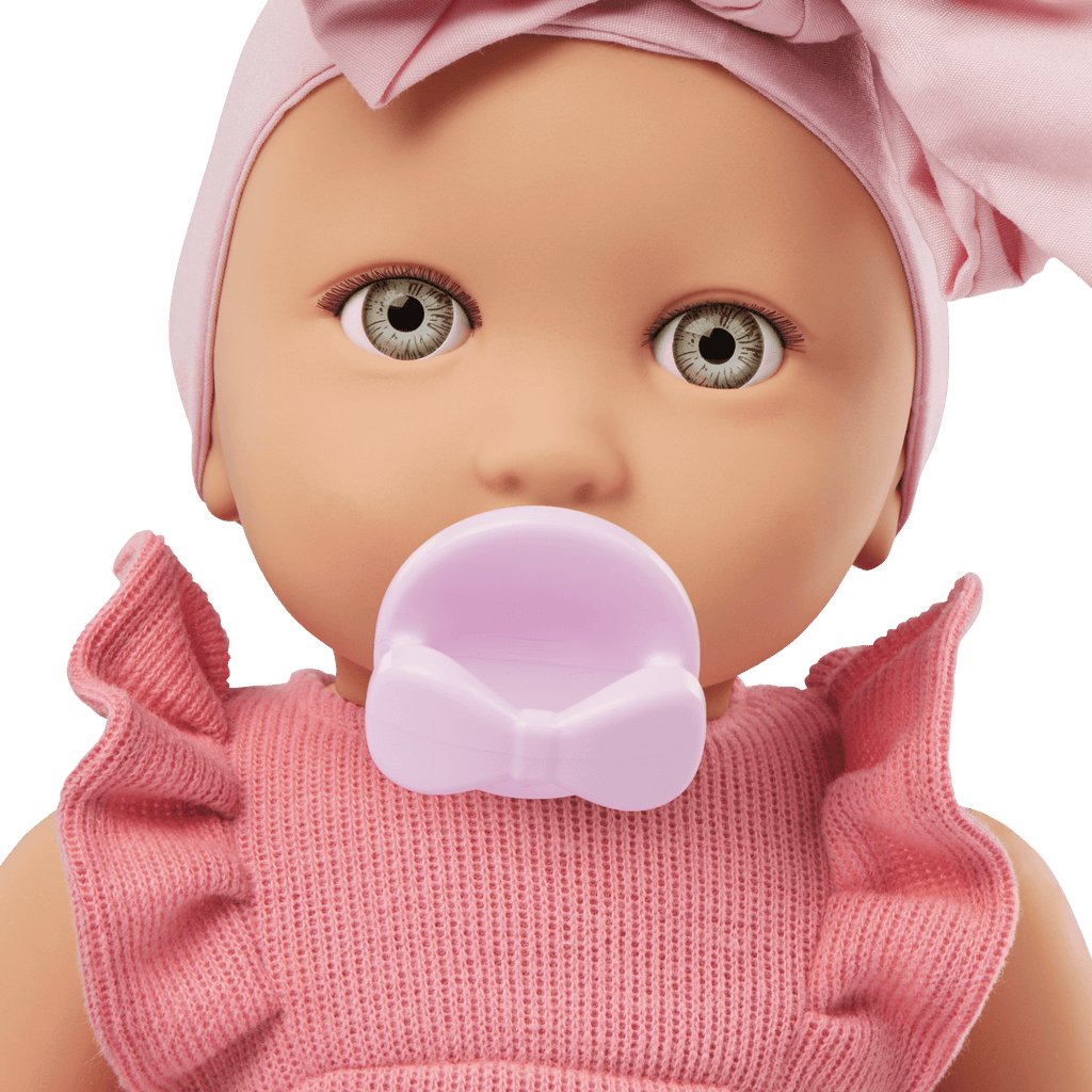 LullaBaby doll in pink romper