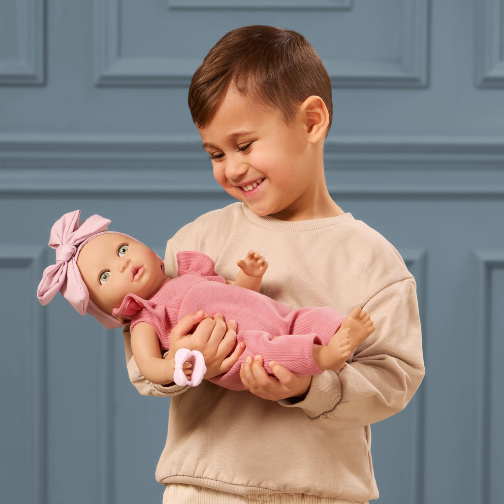 LullaBaby doll in pink romper