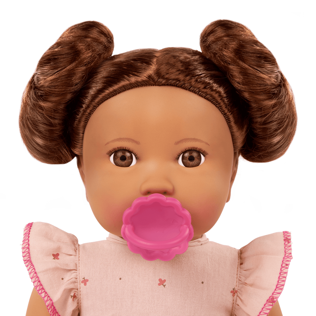 LullaBaby doll with brown hair in pink outfit