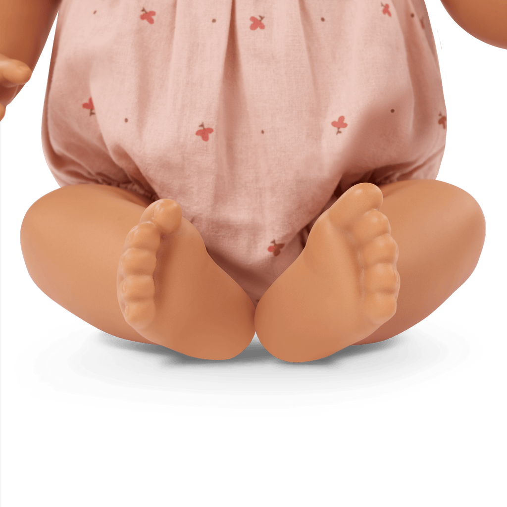 LullaBaby doll with brown hair in pink outfit