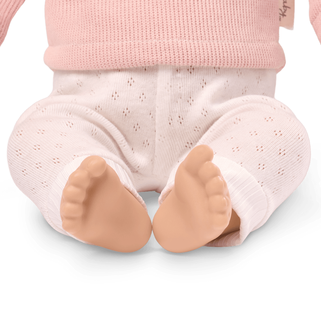 LullaBaby doll with blonde hair and pink comb