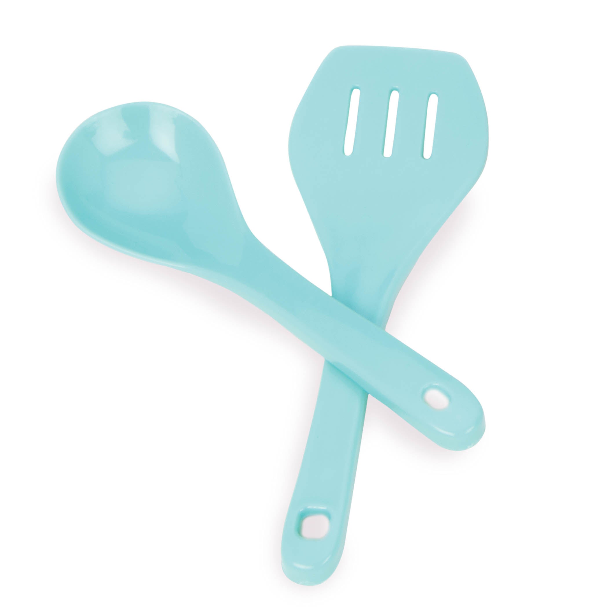 A pink apron set for kids with a chef's hat, oven mitt, and more.IThe Smart Cookie Chef's Apron in a realistc setting, there is an apron, chef's hat, oven mitt, cooking utensils and pot holder.