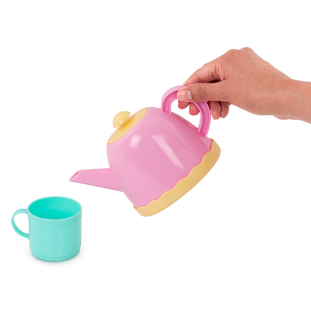 A set of toy dishes including a tea pot.