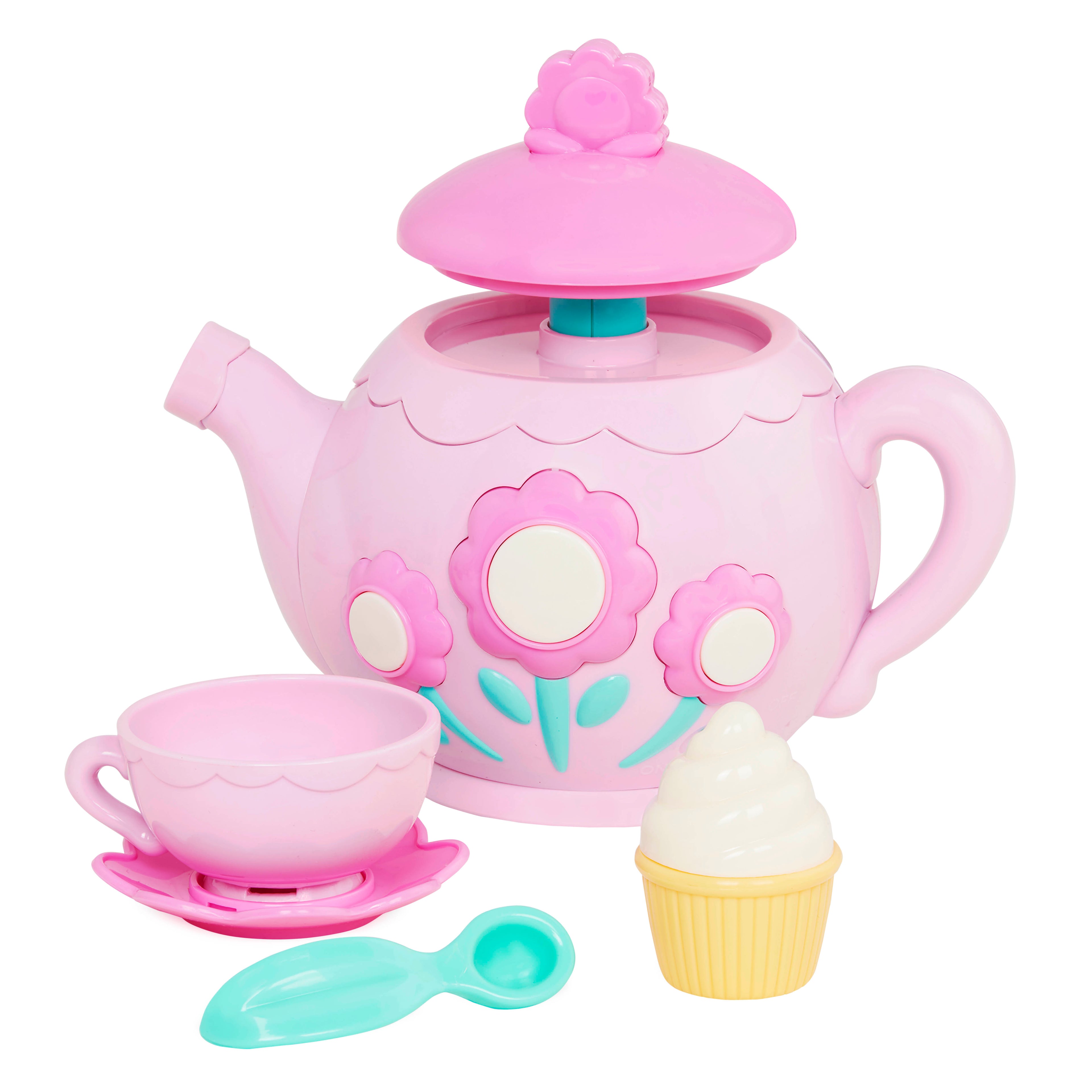 A toy tea set with toy cupcakes.
