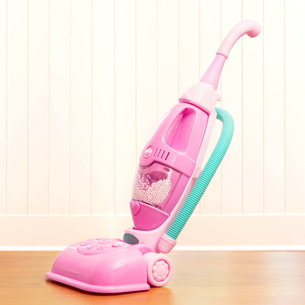 A pink toy vacuum for toddlers and kids.