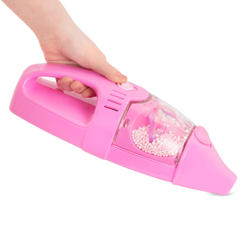 A pink toy vacuum for toddlers and kids.