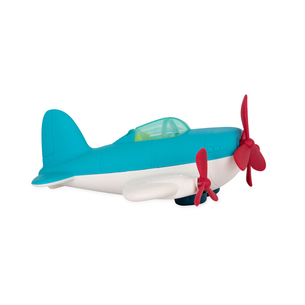 A white and blue airplane toy with red propellors.