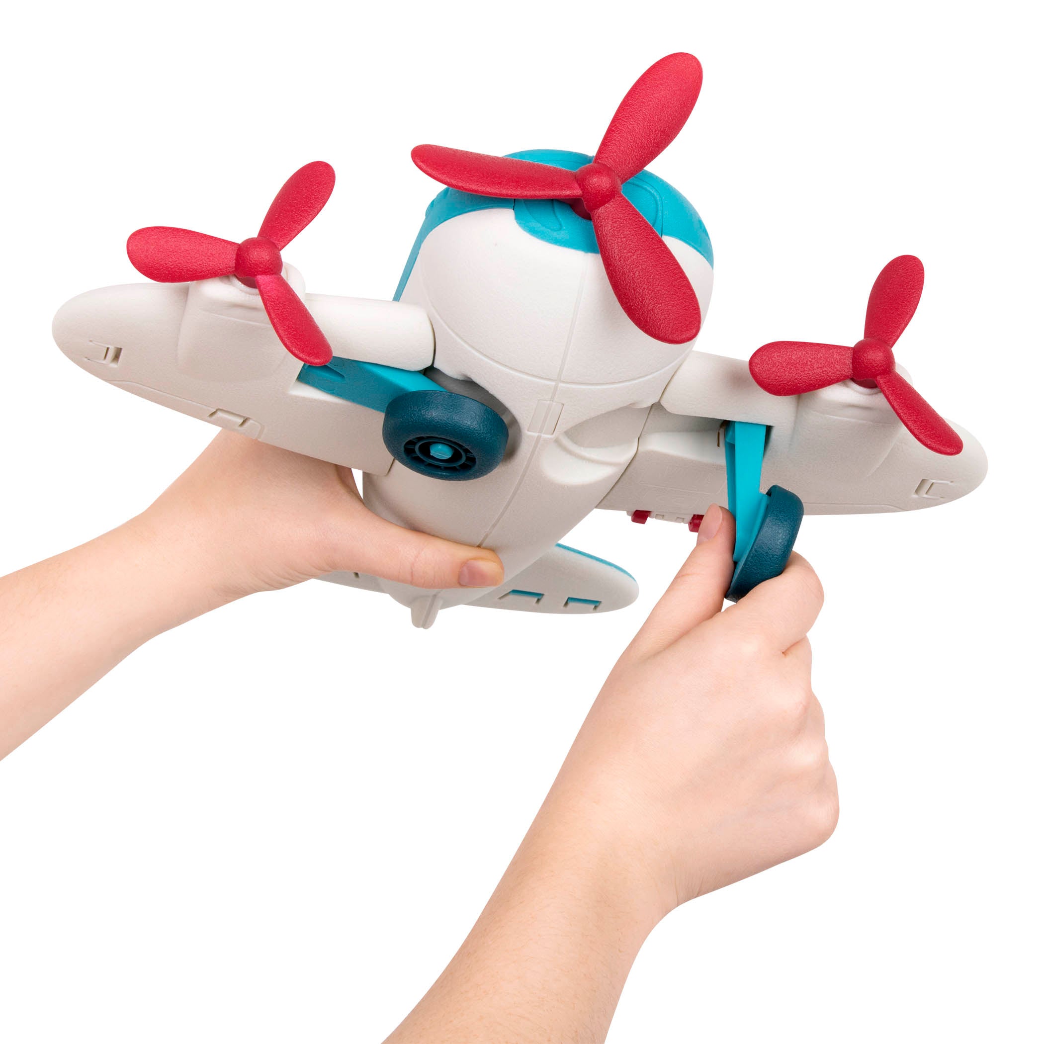 A white and blue airplane toy with red propellors.
