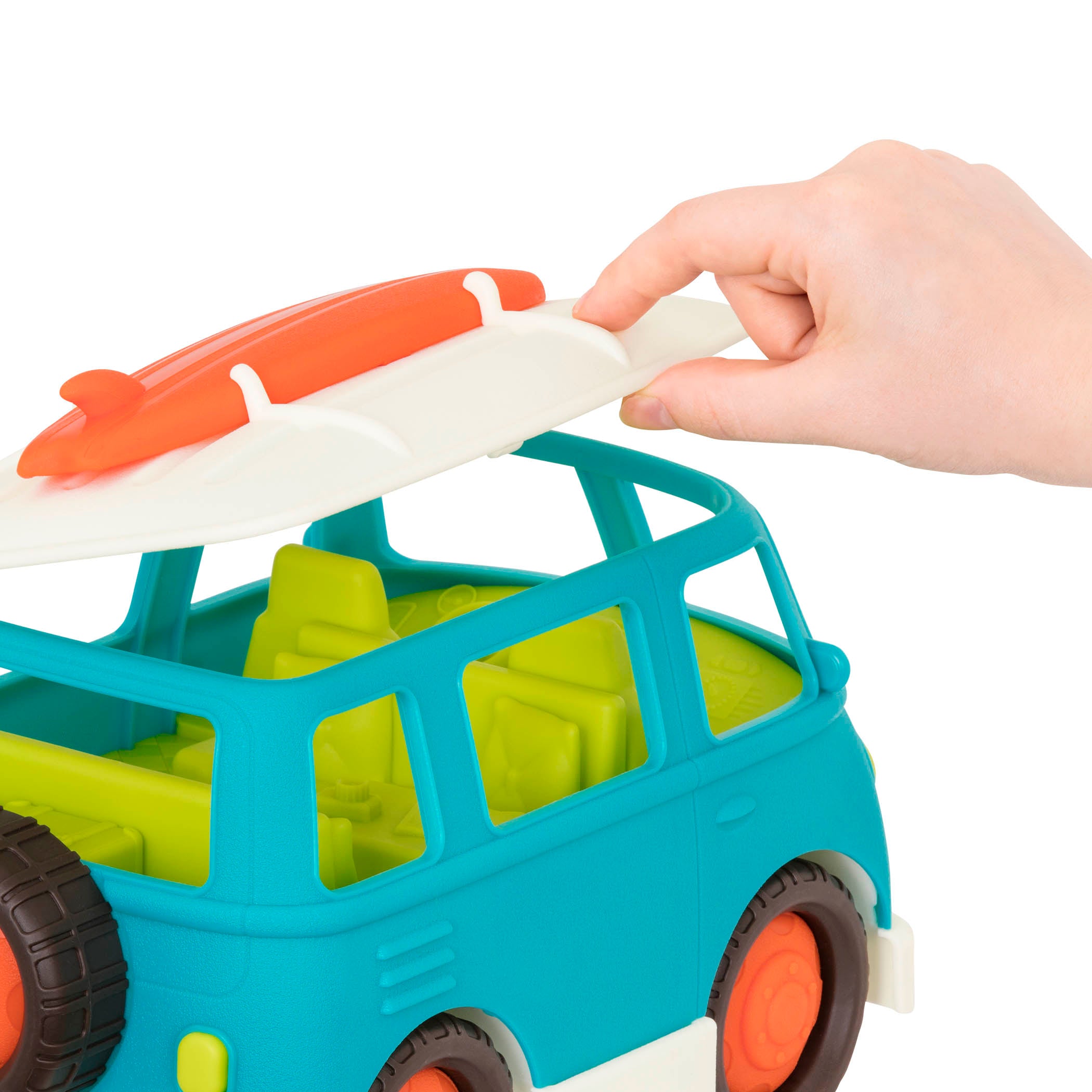 A blue camper van with a green interior and an orange surfboard on top.