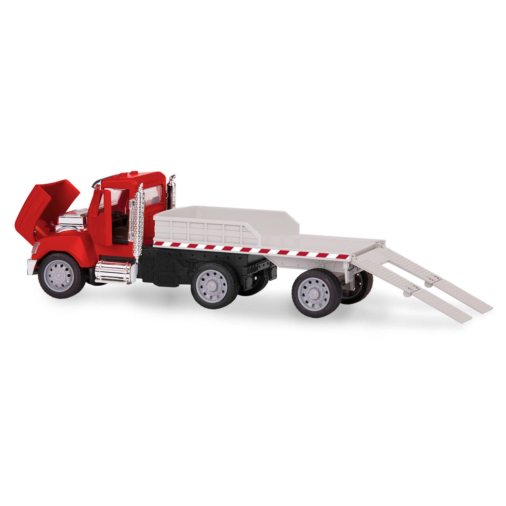 Red toy flatbed truck carrying blue tractor