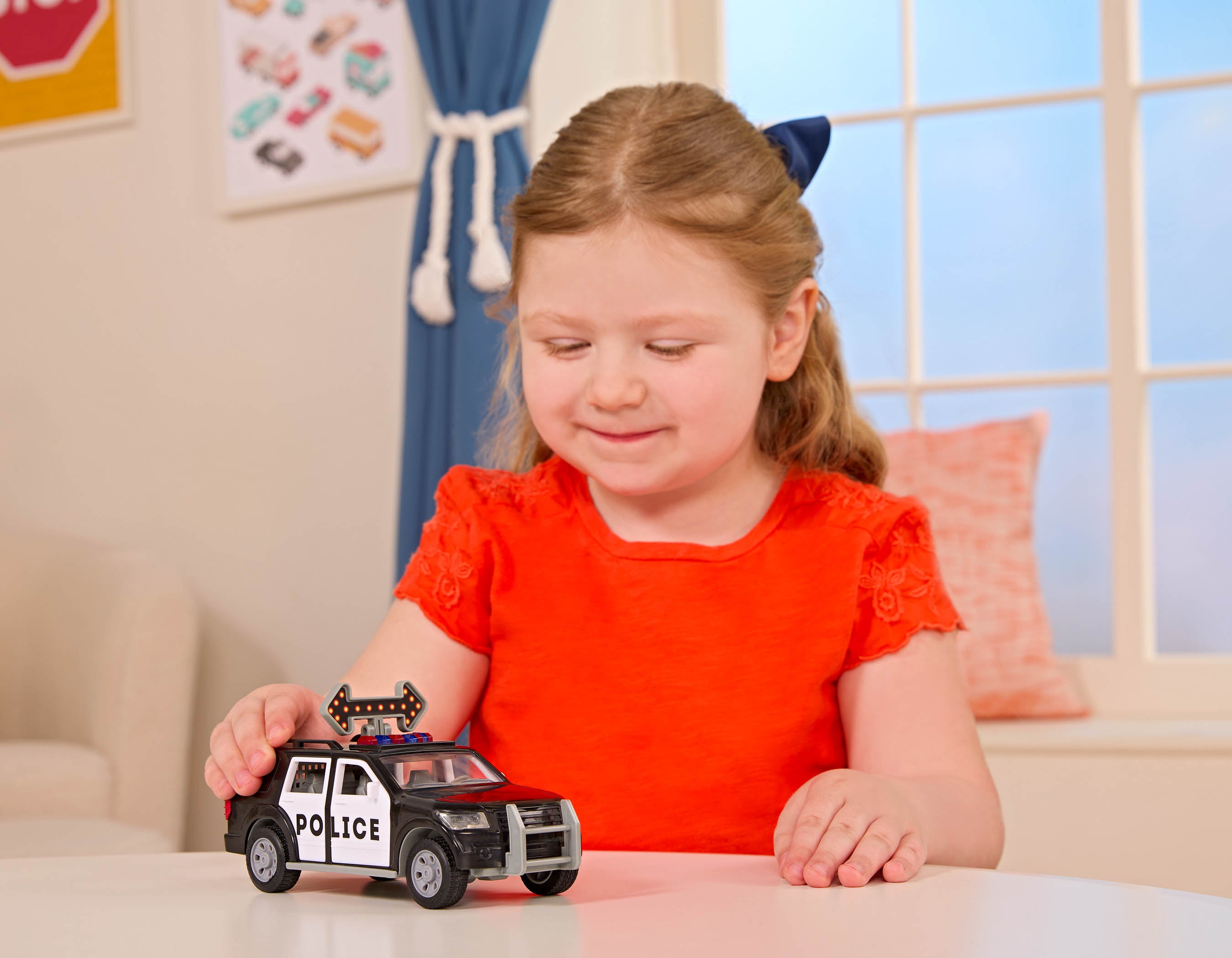 Toy police SUV with light-up arrow.