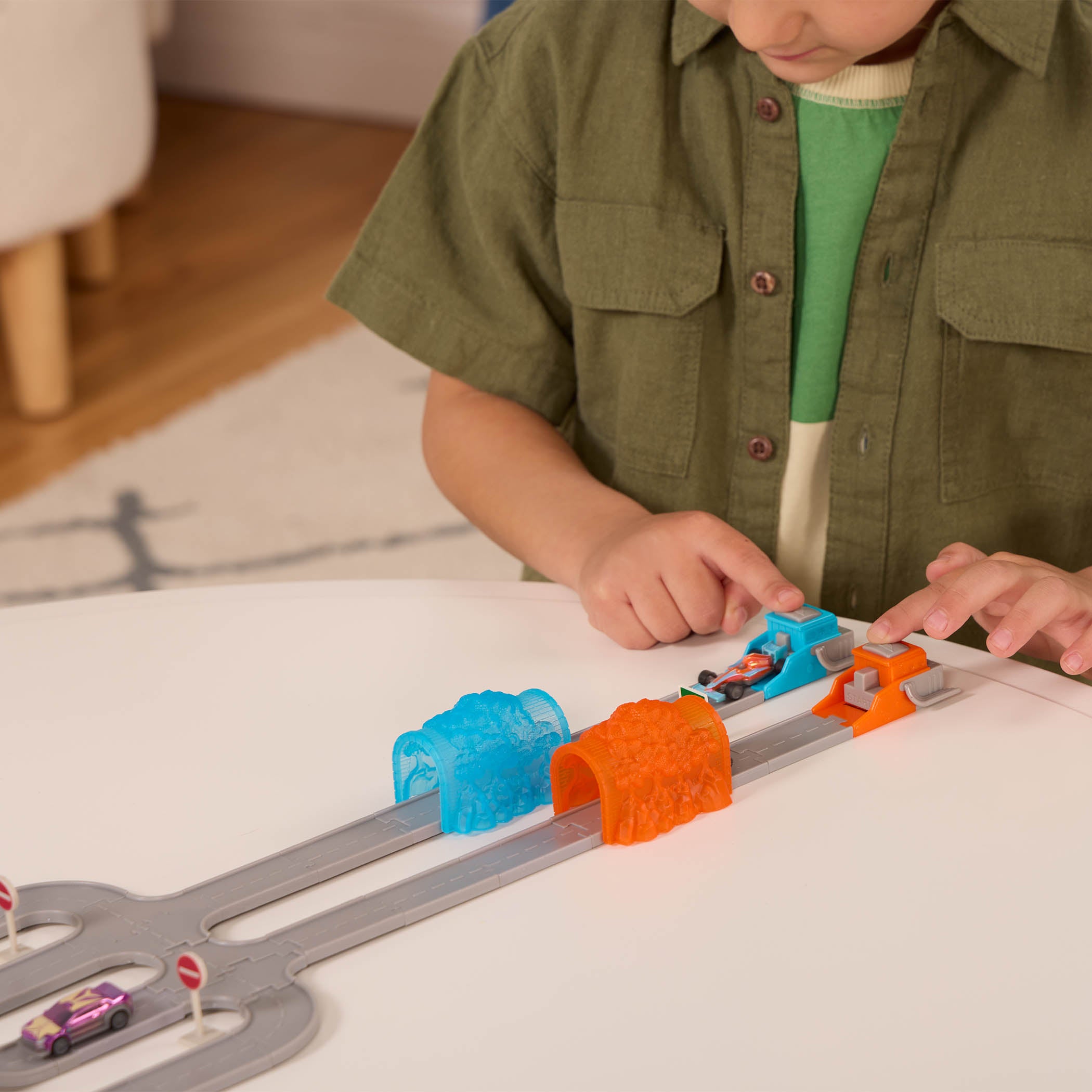 Toy car track with mini vehicles.