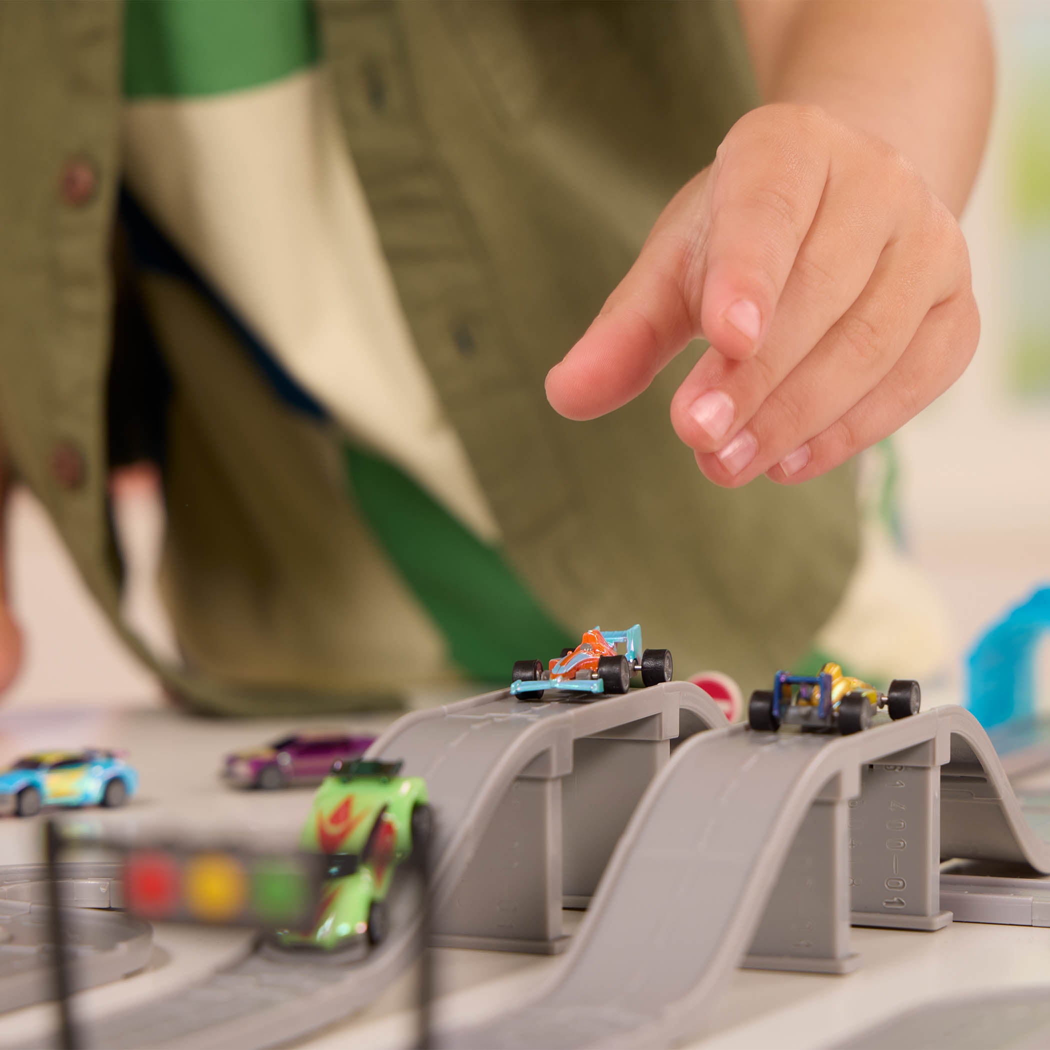 Toy car track with mini vehicles.